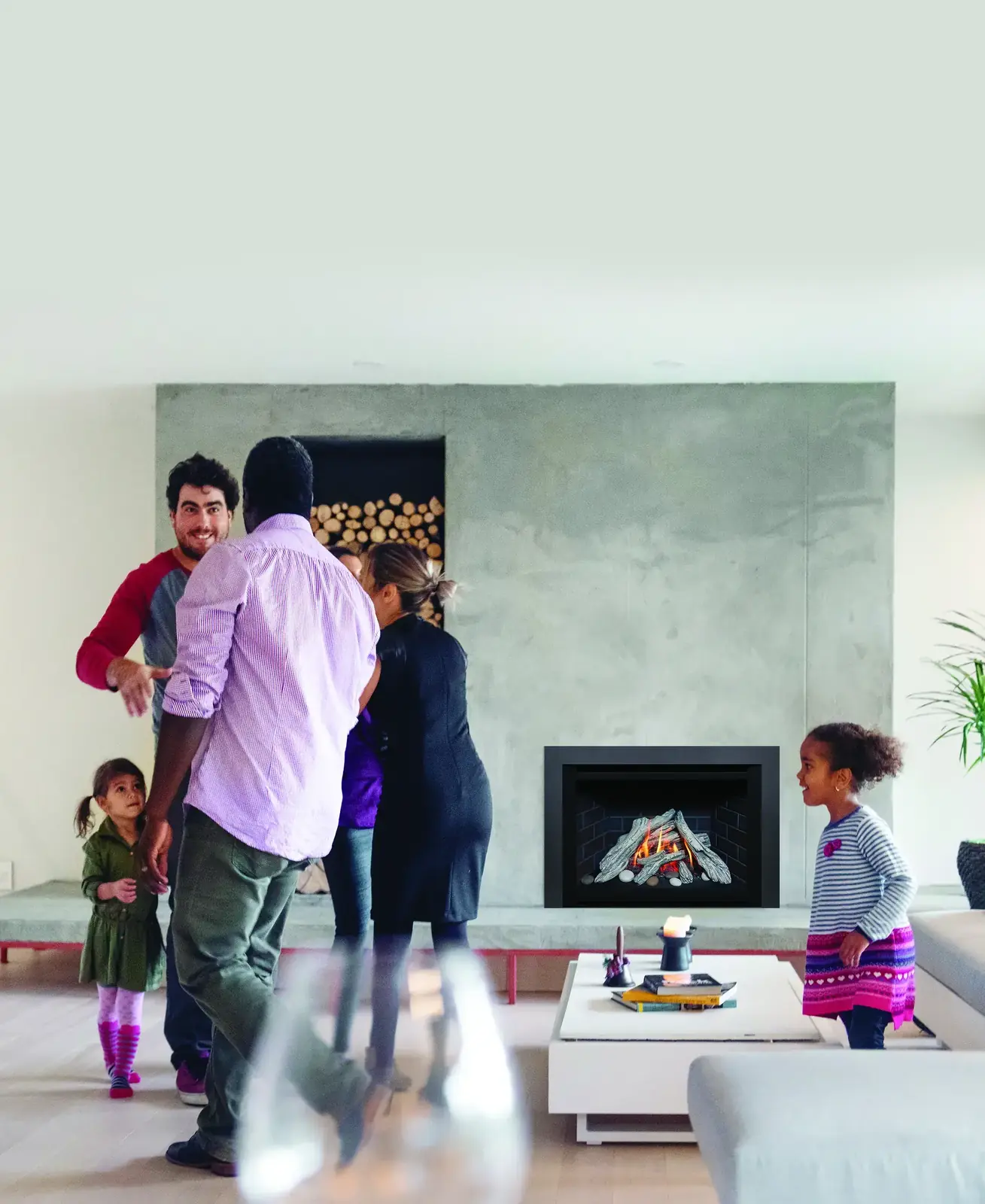 Multigenerational family enjoying a Wisconsin home fireplace